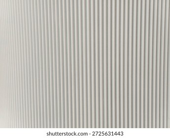 Plastic wall background featuring vertical bar elements arranged in a beautiful repeating pattern, showcasing dimensional depth, structured relief, and a modern decorative surface suitable