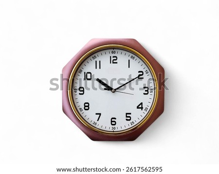 Plastic wall clock with designer frame on the white background