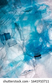 Plastic waste concept , PET bottles on cellophane silhouette