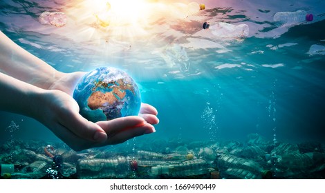 Plastic Waste In The Environment - Ocean Pollution - Hands Holding Earth - elements of this image furnished by NASA
