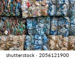 Plastic waste pile, PET bottles collected into bales for recycling