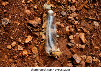 A plastic water bottle found in situ at Garden of the Gods, Colorado Springs, photographed December 17th, 2020. Cleaned up and removed from park by photographer after capture.