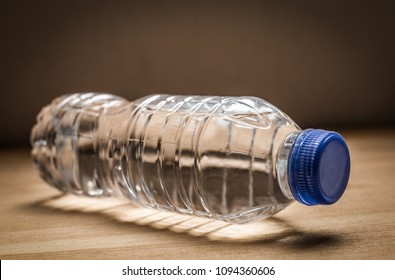 Plastic Water Bottle On Wooden Table