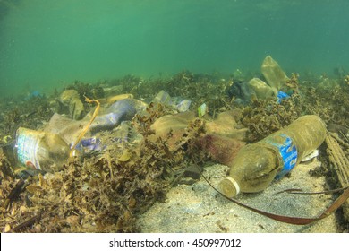 Plastic Water Bottles And Bags Pollution On Sea Floor