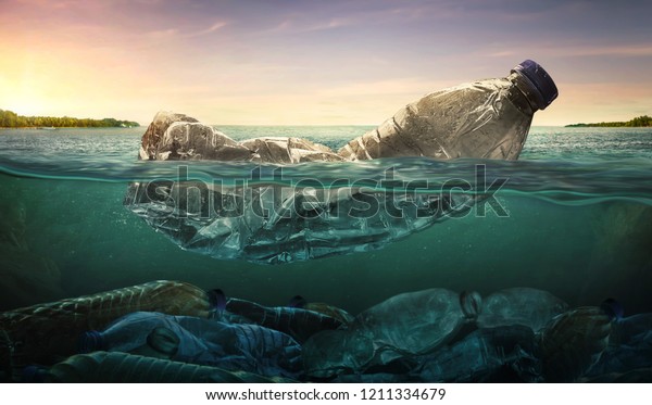 Plastic water bottles pollution in ocean\
(Environment concept)