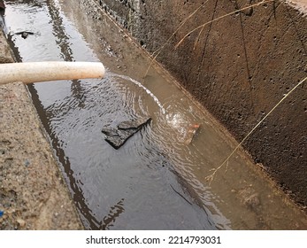 Plastic Water Pipe Hose Carries Water Into The Ditch