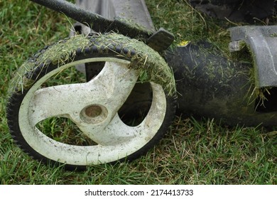 Plastic Wheel On A Push Lawn Mower