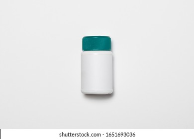 Plastic White Pill Or Vitamin Dietary Supplement Bottle, Medical Drug Plastic Bottle Isolated On White Background With Clipping Path.High Resolution Photo.Top View