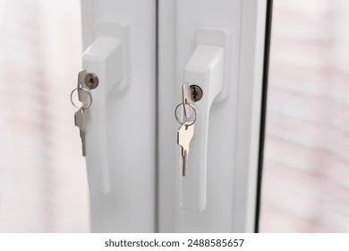 Plastic window closes with a key inserted into the keyhole. Protection for children