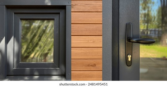 Plastic windows in gray lamination on the wall of a wooden house.