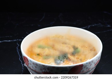 Plastic Wrap Over The Food After Reheated In Microwave. Clear Plastic Shrink Is The Necessary Kitchenware For Keeping Food Clean And Warm. Steamed Water Inside The Plastic Wrap.