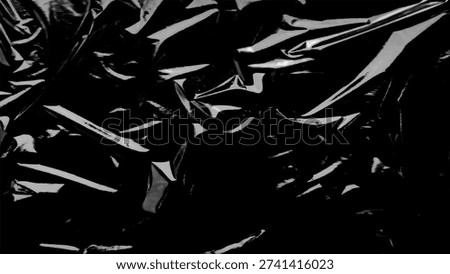 Plastic wrap texture overlay effect on black background. Shrink wrapped plastic sleeve for cover. White plastic