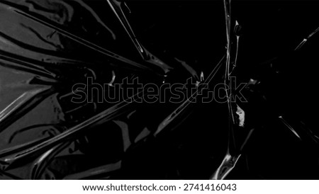 Plastic wrap texture overlay effect on black background. Shrink wrapped plastic sleeve for cover. White plastic