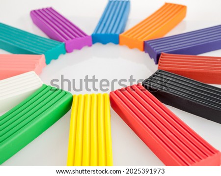 Plasticine in cubes for modeling, games for children, multicolored, close-up, wax plastic clay