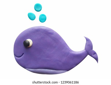 Plasticine cute purple whale spraying water isolated on a white background. Clipping path.