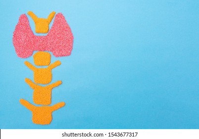 Plasticine Thyroid Gland On A Blue Background. Thyroid Disease Concept, Nodular Goiter, Cancer. Hyperfunction Treatment, Copy Space