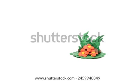 Plasticize molded into nature small flower bushes isolated on white background, handmade plasticine.