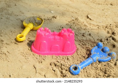 Plastics Sand Toys For Kids On The Beach. Sand Castle Plastic Toy, Rake And Shovel Plastic Toys For Kids. 