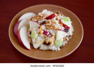 A Plate Of Apple Walnut Salad (similar To Waldorf Salad Without Mayo) On A Blue Plate With Slices