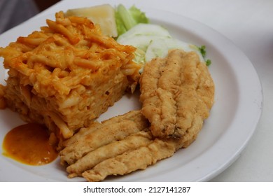 Plate Of Bajan Fried Flying Fish With Macaroni Pie