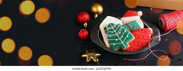 Plate Of Beautiful Christmas Cookies On Black Background With Space For Text