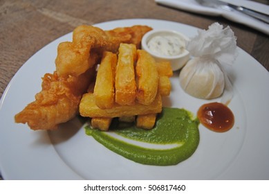 Plate Of Beer Battered Fish And Chips.