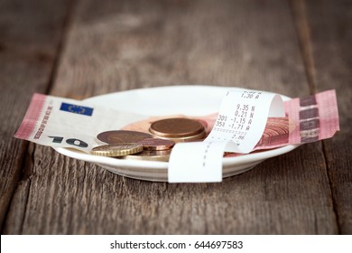 Plate With Bill,money And Tips. Selective Focus.