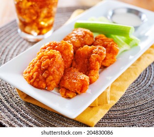 Plate Of Boneless Buffalo Flavored Chicken Wings