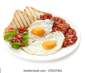 Plate Of Breakfast With Fried Eggs, Bacon And Toasts