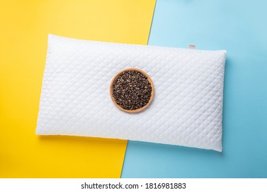 A Plate Of Buckwheat Husks And A White Pillow