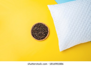 A Plate Of Buckwheat Husks And A White Pillow