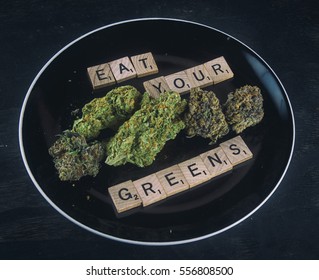 Plate With Cannabis Buds On Black Background - Concept For Infused Medical Marijuana Food