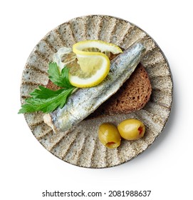 Plate Of Canned Sardine On Bread Slice And Olives Isolated On White Background, Top View