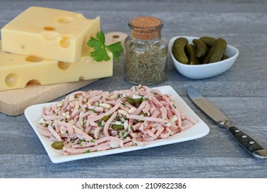 A Plate Of Cheese Sausage Salad.