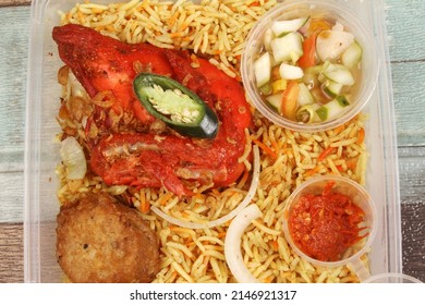 A Plate Of  Chicken Briyani Rice On The Table