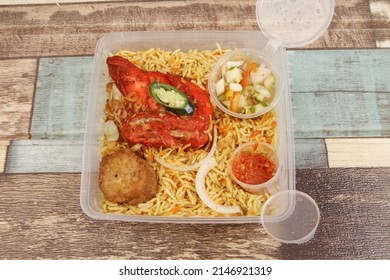 A Plate Of  Chicken Briyani Rice On The Table