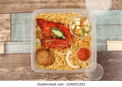 A Plate Of  Chicken Briyani Rice On The Table