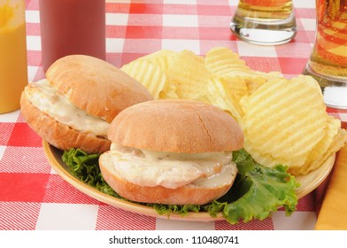 A Plate Of Chicken Sandwiches With Monterrey Jack Cheese And Beer