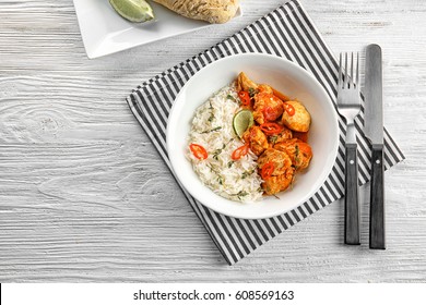 Plate With Chicken Tikka Masala And Rice On White Table