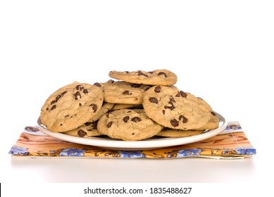 A plate of chocolate chip cookies with a white background. 