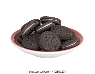 Plate Of Chocolate Cream Filled Cookies Isolated On White