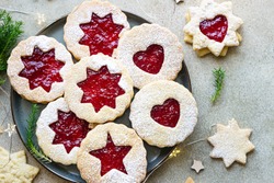 Plate With Christmas Or New Year Shortcrust Cookies With Red Jam. Traditional Festive Austrian Cookies With Jam. Linzer Cookies.