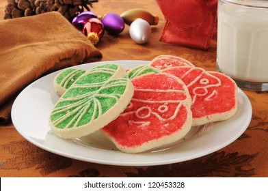 A Plate Of Christmas Sugar Cookies Shaped Like Santa And Candy Canes