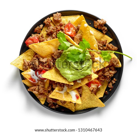 plate of corn chips nachos with fried minced meat and guacamole isolated on white background, top view