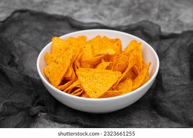 plate of corn chips nachos with guacamole on white plate - Powered by Shutterstock