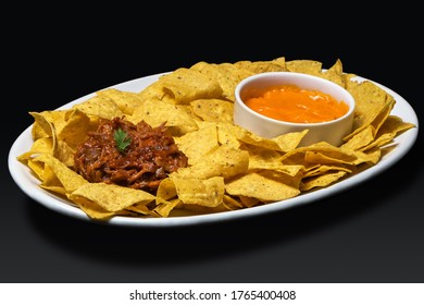 Plate Of Corn Chips Nachos With Shredded Meat And Cheese