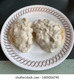 A Plate With Country Style Biscuits And Gravy.