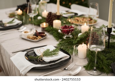 Plate decorated with fir branch displayed on festive christmas table fully prepared for celebration - Powered by Shutterstock