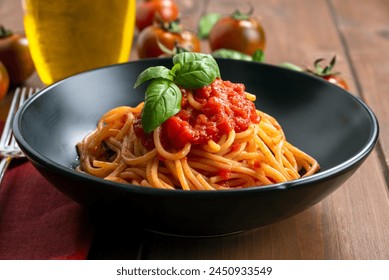 Plate of delicious classic tomato sauce and basil spaghetti, italian pasta, mediterranean diet  - Powered by Shutterstock