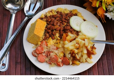 A Plate Of Delicious, Comfort Food, That Has Been Served In The Appalachian Mountains For Many Years.  It Includes Pinto Beans, Cornbread, Fried Potatoes, Sauerkraut And Weiners, With Some Slices Of O